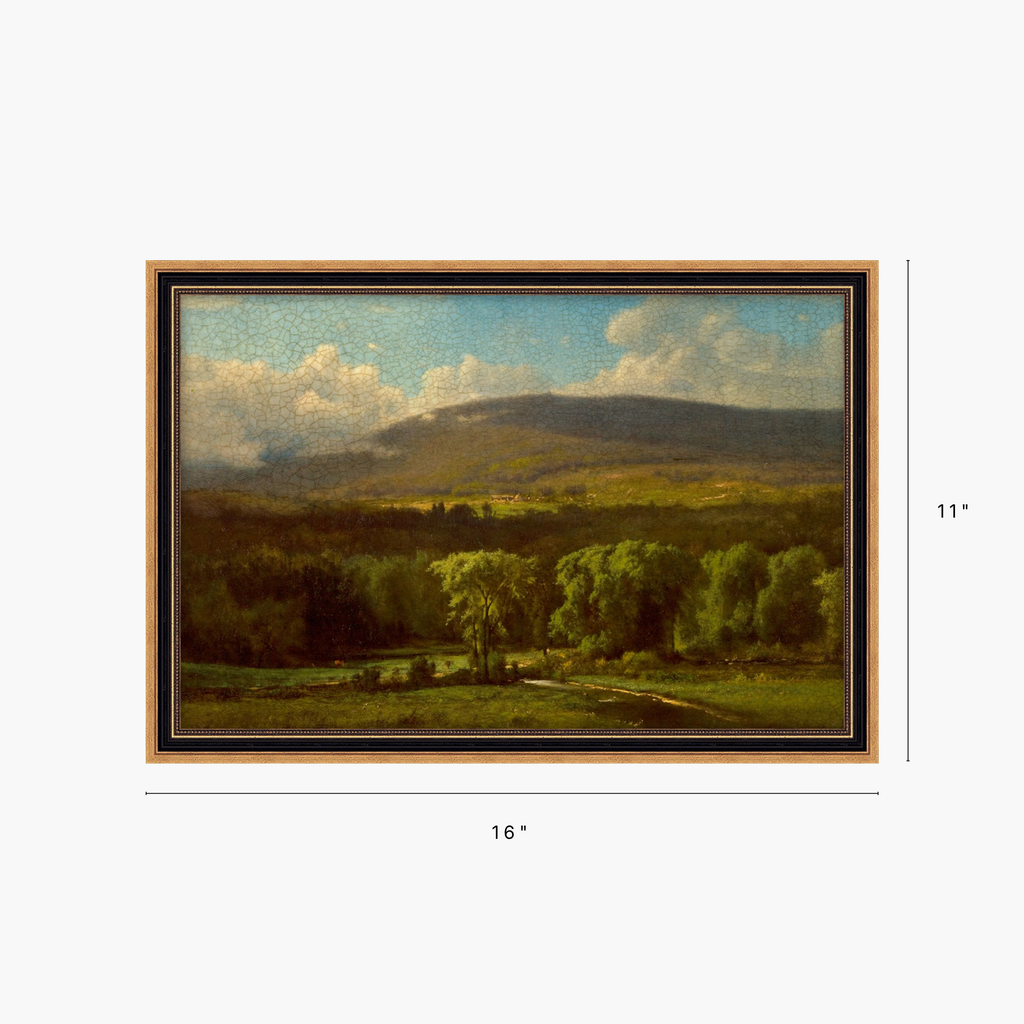 Framed landscape painting shown on a light gray background with dimension markers indicating 16 inches wide by 11 inches tall. The artwork depicts green fields, trees, a dark hillside, and a blue sky with white clouds.