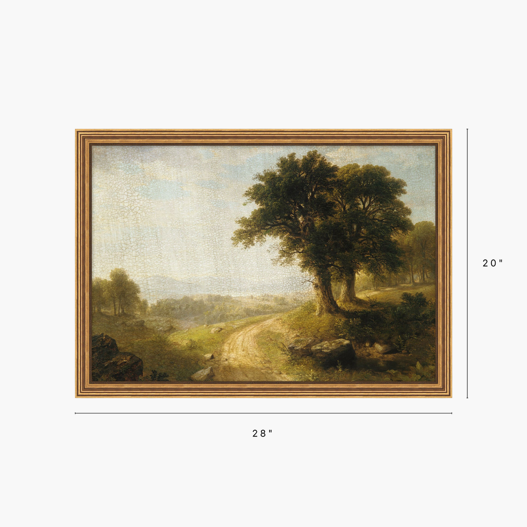 A framed landscape painting showing a tree, a winding dirt road, and distant hills under a pale sky, with dimension labels indicating 28 inches wide by 20 inches tall.