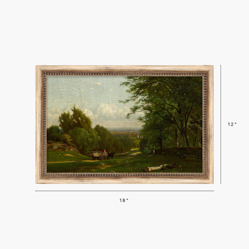 A framed landscape painting shown on a light gray background with dimension markers indicating 18 inches wide by 12 inches tall. The artwork depicts green trees, grassy fields, and a distant valley under a pale sky, enclosed in a light wood frame.