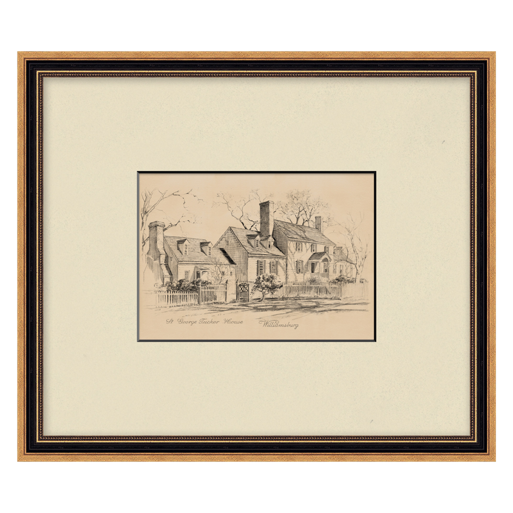 Framed black and white drawing of a house on a beige background